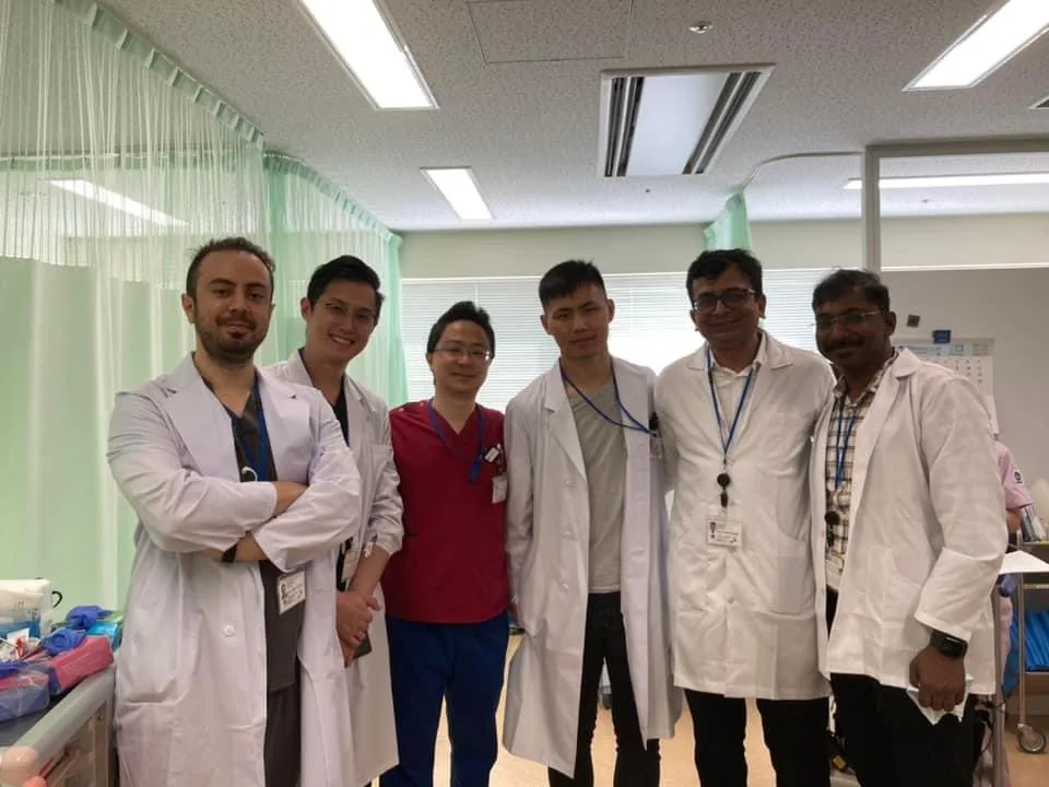Dr. Arvind Patel on the ward with the host surgical unit during an overseas observership