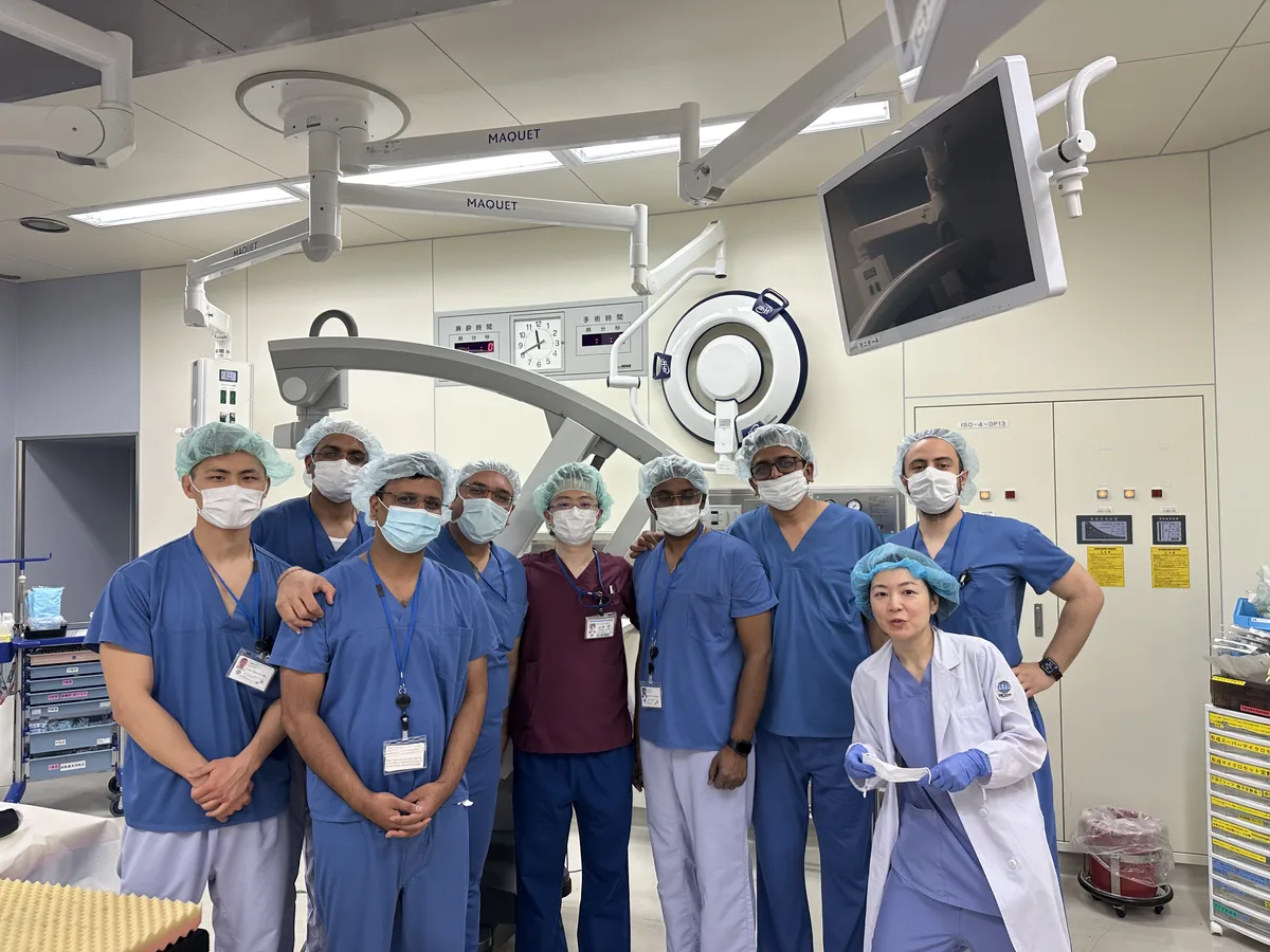 Dr. Arvind Patel with the surgical team in theatre during an overseas microsurgery observership