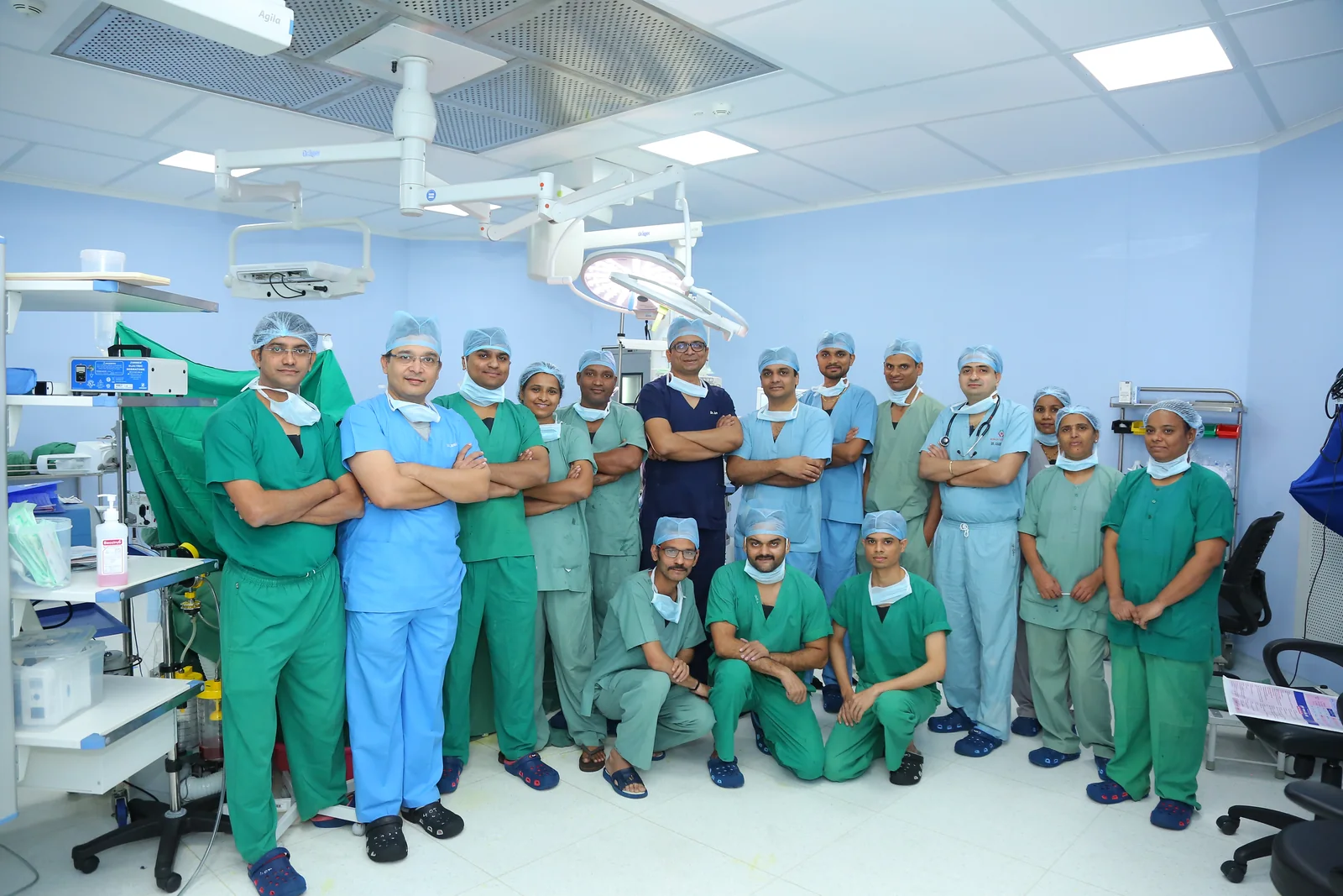 The surgical and theatre team in an operating theatre at Kiran Multi-Superspeciality Hospital, Katargam, Surat